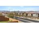 Street view of modern homes with well-maintained landscaping and desert mountain views at 10052 Silver Comet Ct, Las Vegas, NV 89178