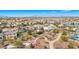 Expansive aerial view shows the neighborhood, community park, and Las Vegas cityscape at 1033 Via Dell Bacio Dr, Henderson, NV 89052