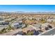 Expansive community aerial view with diverse homes, green spaces, and stunning mountain backdrop at 1033 Via Dell Bacio Dr, Henderson, NV 89052