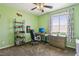 Neat bedroom featuring an ergonomic desk, modern computer, and comfortable furnishings at 1033 Via Dell Bacio Dr, Henderson, NV 89052