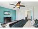 Well-lit bedroom with a mounted television and a modern dresser at 1033 Via Dell Bacio Dr, Henderson, NV 89052