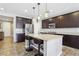 Beautiful kitchen featuring granite countertops, stainless steel appliances, and custom cabinetry at 1033 Via Dell Bacio Dr, Henderson, NV 89052