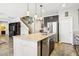 Beautiful kitchen island featuring granite counters, stainless steel appliances, and custom cabinetry at 1033 Via Dell Bacio Dr, Henderson, NV 89052