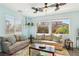 Cozy living room with neutral colors, large windows and a relaxing atmosphere at 1033 Via Dell Bacio Dr, Henderson, NV 89052