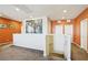 Loft with neutral carpet and brightly painted walls, leading to several doors at 1033 Via Dell Bacio Dr, Henderson, NV 89052