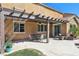 Inviting covered patio with an outdoor dining area and relaxing seating at 1033 Via Dell Bacio Dr, Henderson, NV 89052