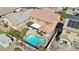 Aerial showcases the inviting pool, spa, and covered patio with a landscaped yard at 1033 Via Dell Bacio Dr, Henderson, NV 89052