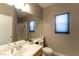 Bathroom featuring a large mirror, vanity, toilet, and enclosed shower at 1056 Sweeping Ivy Ct, Las Vegas, NV 89183