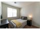 Bedroom with natural light and a yellow blanket on the bed and dark furniture at 1056 Sweeping Ivy Ct, Las Vegas, NV 89183