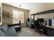 Bedroom featuring a desk with gaming setup and a gray couch for relaxing at 1056 Sweeping Ivy Ct, Las Vegas, NV 89183