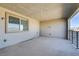 Spacious balcony featuring neutral tones, black metal railing, and a window offering natural light at 1103 Tektite Ave, Henderson, NV 89011