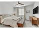 Well-lit bedroom with contemporary design, showcasing a comfortable bed, dresser, and ample natural light at 1103 Tektite Ave, Henderson, NV 89011