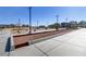 Community bocce ball court with lighting for evening play, surrounded by landscaping and seating areas at 1103 Tektite Ave, Henderson, NV 89011