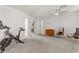 Bonus room with neutral carpet, ceiling fan, and a glimpse into a nearby office space at 1103 Tektite Ave, Henderson, NV 89011