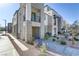 Modern townhouse exterior featuring a stone facade and private balcony at 1103 Tektite Ave, Henderson, NV 89011