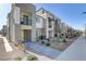 Charming townhouse with a stone facade, balcony, and well-manicured landscaping at 1103 Tektite Ave, Henderson, NV 89011