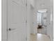 Hallway leading to a well-lit bedroom, enhancing the home's flow at 1103 Tektite Ave, Henderson, NV 89011