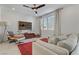 Cozy living room with a plush sofa, accent chairs, and a decorative rug at 1103 Tektite Ave, Henderson, NV 89011