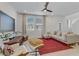 Bright living room boasting modern furniture, large windows, and a stylish red rug for a cozy ambiance at 1103 Tektite Ave, Henderson, NV 89011