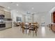 Bright open-plan living room with modern furnishings and tile flooring at 1103 Tektite Ave, Henderson, NV 89011