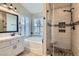 Bright bathroom featuring a tub, a shower with glass door, and ample natural light at 1110 Legato Dr, Las Vegas, NV 89123