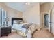 Cozy bedroom with neutral tones, a comfortable bed, and a window providing natural light at 1110 Legato Dr, Las Vegas, NV 89123