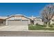 Charming single-story home with a three-car garage and well-maintained front yard at 1110 Legato Dr, Las Vegas, NV 89123