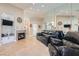 Spacious living room with a fireplace, tile flooring, and a mirrored wall at 1110 Legato Dr, Las Vegas, NV 89123