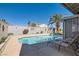 Beautiful backyard swimming pool with lounge chairs and manicured landscaping, perfect for relaxation at 1110 Legato Dr, Las Vegas, NV 89123