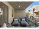 Relax on this charming balcony with outdoor lounge chairs, perfect for enjoying the outdoors at 11256 Rainbow Peak Ave # 207, Las Vegas, NV 89135