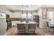 Bright kitchen with modern appliances, island seating, and stylish pendant lighting for an inviting culinary space at 11256 Rainbow Peak Ave # 207, Las Vegas, NV 89135