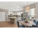 Bright kitchen and dining area with pendant lighting, stainless steel appliances, and stylish decor at 11256 Rainbow Peak Ave # 207, Las Vegas, NV 89135