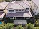 Aerial image showcasing patio, pergola, red tiled roof and backyard in this peaceful residential area at 12054 Portamento Ct, Las Vegas, NV 89138