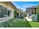 Inviting backyard with outdoor kitchen, fireplace, grill and seating area with a view at 12054 Portamento Ct, Las Vegas, NV 89138