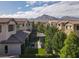 Picturesque backyard view showcasing a pergola and manicured landscape, backing to mountain view at 12054 Portamento Ct, Las Vegas, NV 89138