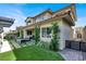 Cozy backyard featuring a patio with modern furniture and manicured landscaping at 12054 Portamento Ct, Las Vegas, NV 89138