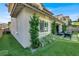 Exterior side yard view with turf, foliage, and seating area with a view at 12054 Portamento Ct, Las Vegas, NV 89138