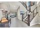 Inviting foyer with staircase, modern decor, and a glimpse of the living room at 12054 Portamento Ct, Las Vegas, NV 89138