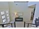 Bright foyer with double glass doors, console table, and view into the open-concept living space at 12054 Portamento Ct, Las Vegas, NV 89138