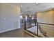 Second floor hallway with metal stair railing, leading to office area with modern decor at 12054 Portamento Ct, Las Vegas, NV 89138