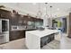 Modern kitchen featuring a quartz countertop island and stainless steel appliances at 12054 Portamento Ct, Las Vegas, NV 89138