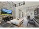 Spacious living room showcasing the accent wall, second story overlook, and open concept design at 12054 Portamento Ct, Las Vegas, NV 89138