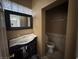 Bathroom featuring a toilet, tile work, mirror, and vanity at 1275 Westwind Rd, Las Vegas, NV 89146