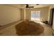 View of a bedroom with a ceiling fan and sliding glass doors leading to the backyard at 1275 Westwind Rd, Las Vegas, NV 89146