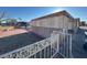 This exterior shows a gravel yard and white iron fence at 1275 Westwind Rd, Las Vegas, NV 89146