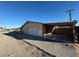 The exterior of this home features a large garage and open driveway at 1275 Westwind Rd, Las Vegas, NV 89146