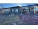 Exterior view of the home featuring a unique overhang and a driveway at 1275 Westwind Rd, Las Vegas, NV 89146