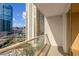 This balcony features glass railings overlooking city views at 135 E Harmon Ave # 701, Las Vegas, NV 89109