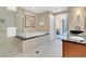 Bright bathroom featuring double vanities, a soaking tub and separate shower with modern tile work at 135 E Harmon Ave # 701, Las Vegas, NV 89109