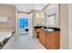 Bright bathroom featuring a vanity, a soaking tub and tile floors that give a touch of modern style at 135 E Harmon Ave # 701, Las Vegas, NV 89109